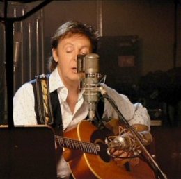 Sir Paul utilizes a microphone in studio for great acoustic tone.