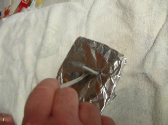 tin foil perforated to permit air to circulate